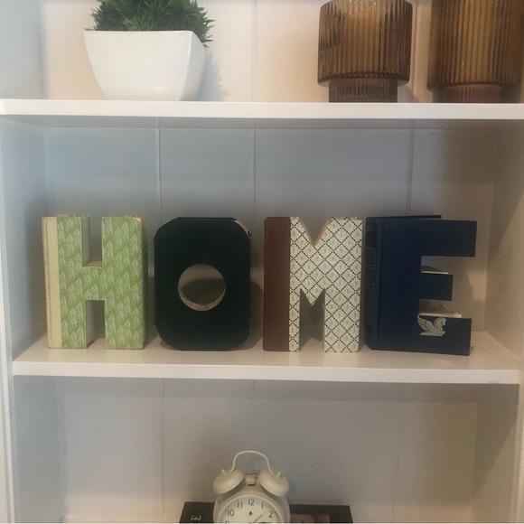 Anthropologie: Hand cut letters from Reader’s Digest books. Spells out “HOME.” - Picture 2 of 15